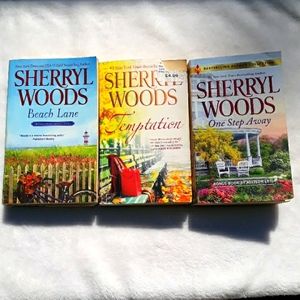 2 Sherryl Woods paperback books-  One Step Away, Temptation,  & Beach Lane